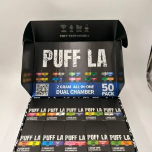 Open Puff LA dual chamber display box featuring 50 dual-flavor 2G disposable vapes.