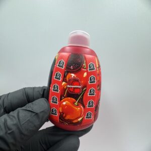 Red cherry pattern Backpackboyz 2g vape device with 5 Points logo held in hand