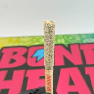 Bone Head 1.5G infused joint coated in liquid diamonds and kief with a RAW filter tip