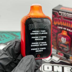 The back of the red Volumes 2G vape device showing printed button instructions.