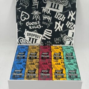 An open display box revealing ten Dropout 3G Trimester III devices and a graffiti-covered interior lid.