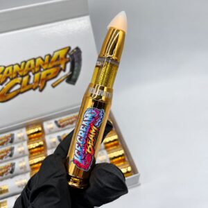 Hand holding the Hollow Tips 2g Disposable gold bullet vaporizer in Ice Cream Beam flavor