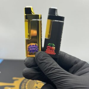 Reverse side of the connected Muha Meds Gen 2x2 Magnets 4G device showing Purple Punch and Ibiza Cherry strains