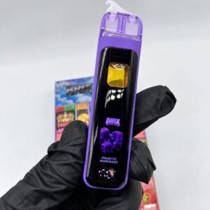 Close-up of a purple Brix 2G disposable vape in the Galactic Warheads flavor.