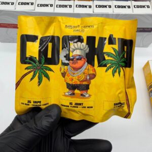 Close-up of the Cook'd pre roll and gummies pack