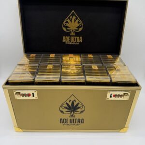 An open metallic gold security case displaying rows of shiny gold boxes inside the Ace Ultra Premium 4g Disposable Master Box.